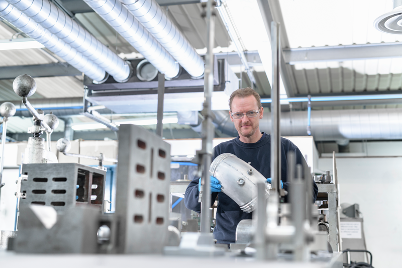 Man engineer in manufacture - Getty Images